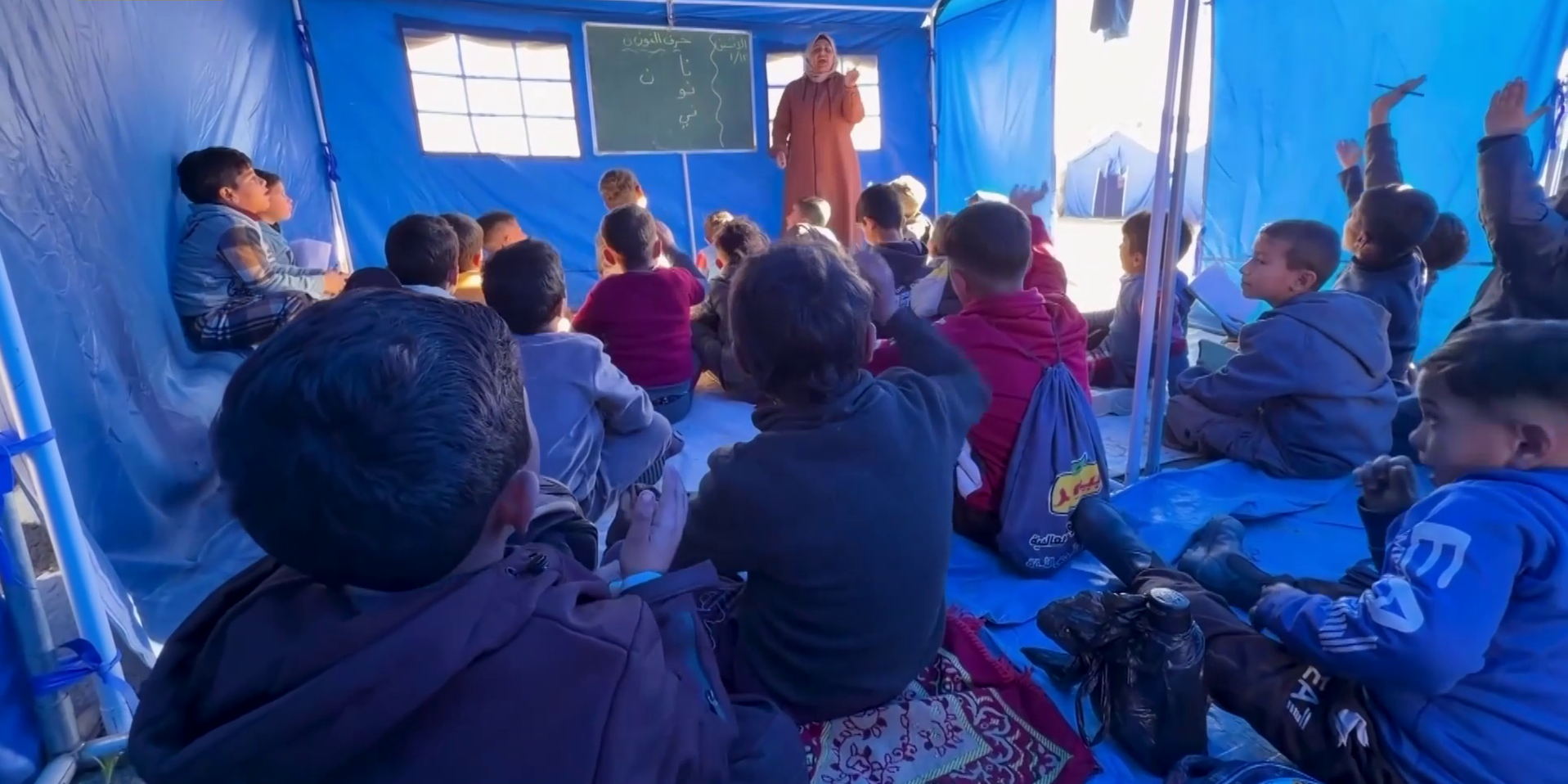Gaza children go back to school in makeshift tent after rubbles