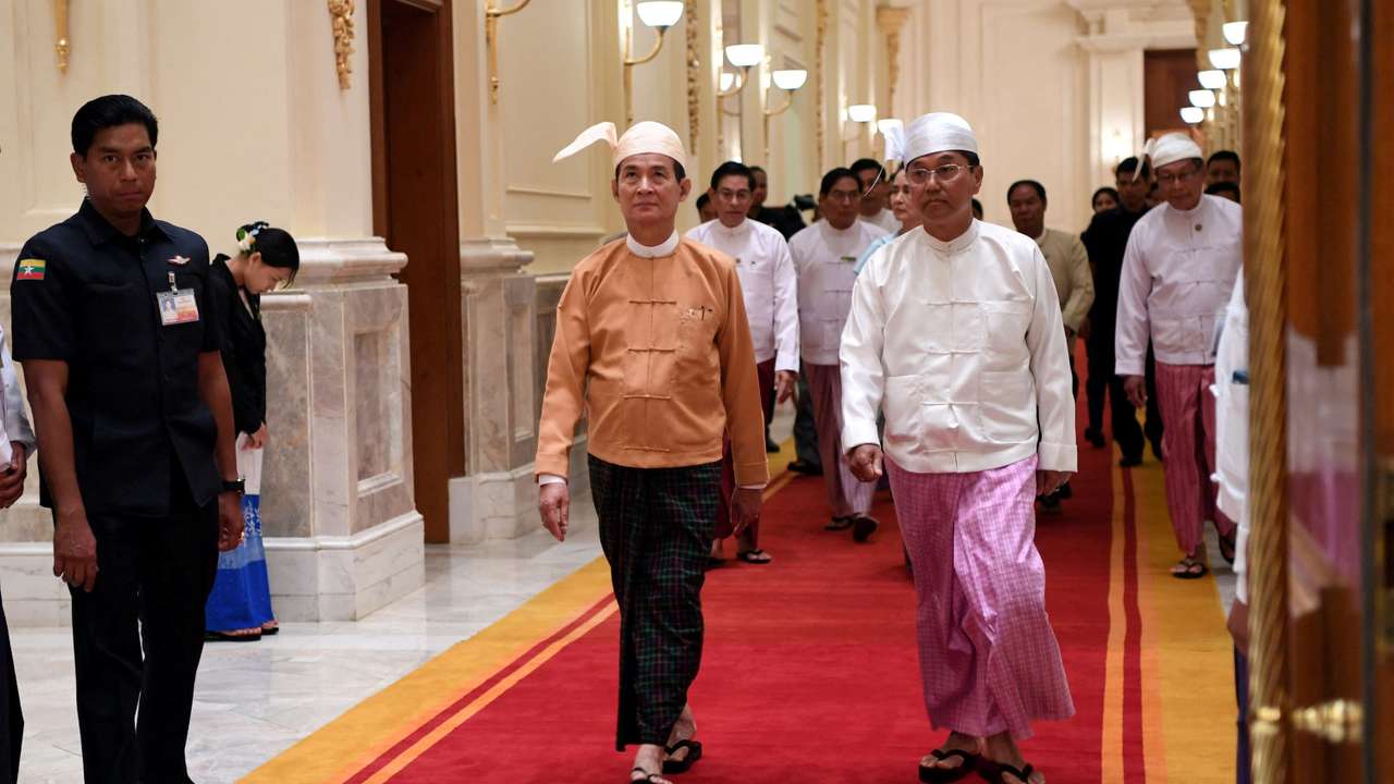 FILE PHOTO: Newly elected Myanmar President Win Myint (C) and Vice President Myint Swe arrive at the presidential palace at Naypyitaw