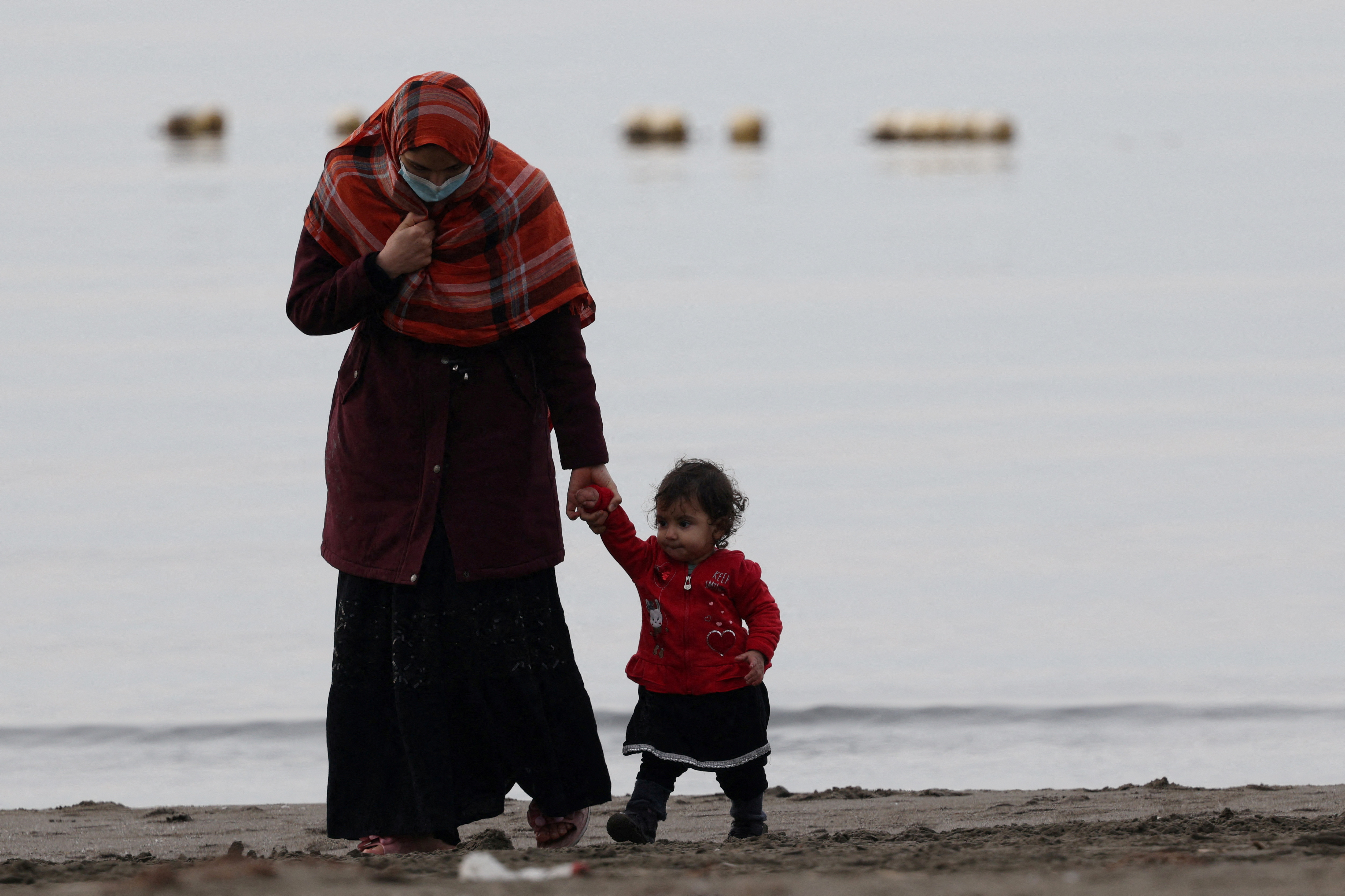 Afghan migrants are seen as they hope of going to the U.S., in the coastal town of Shengjin