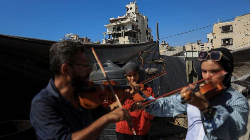 The Wider Image: Gaza's young musicians sing and play in the ruins of war