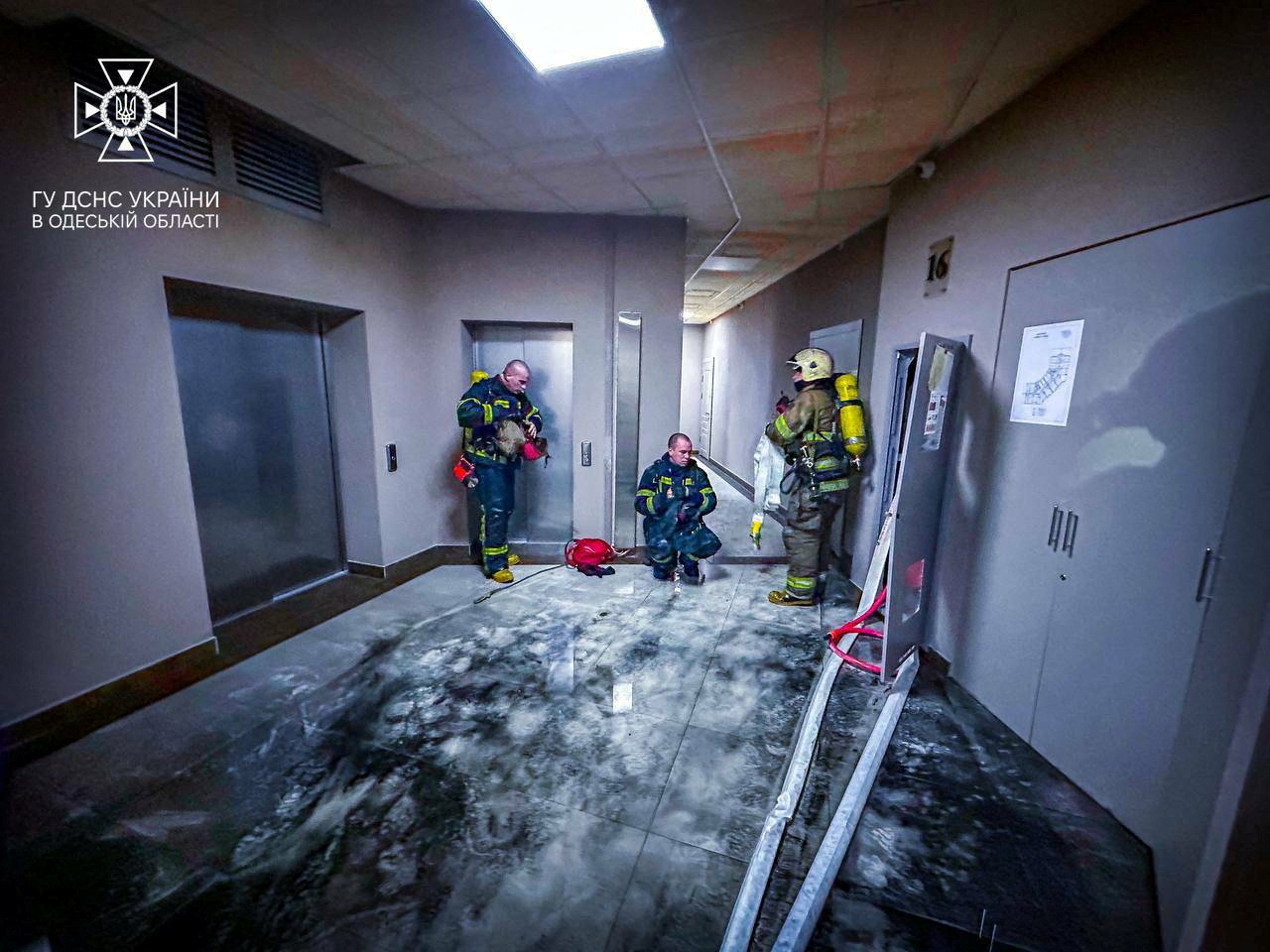 Rescuer work at the site damaged by the debris of a downed drone