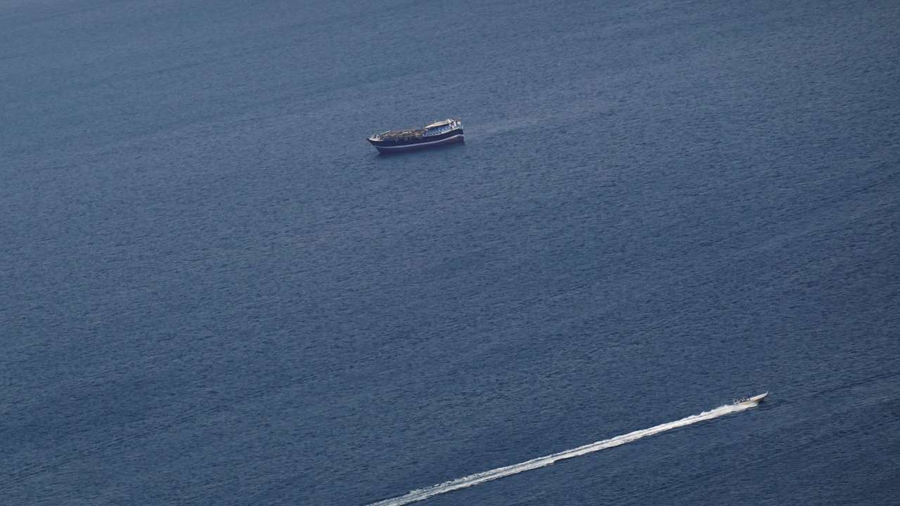 FILE PHOTO: Boats in the Strait of Hormuz amid the U.S.-Israeli conflict with Iran, as seen from Musandam