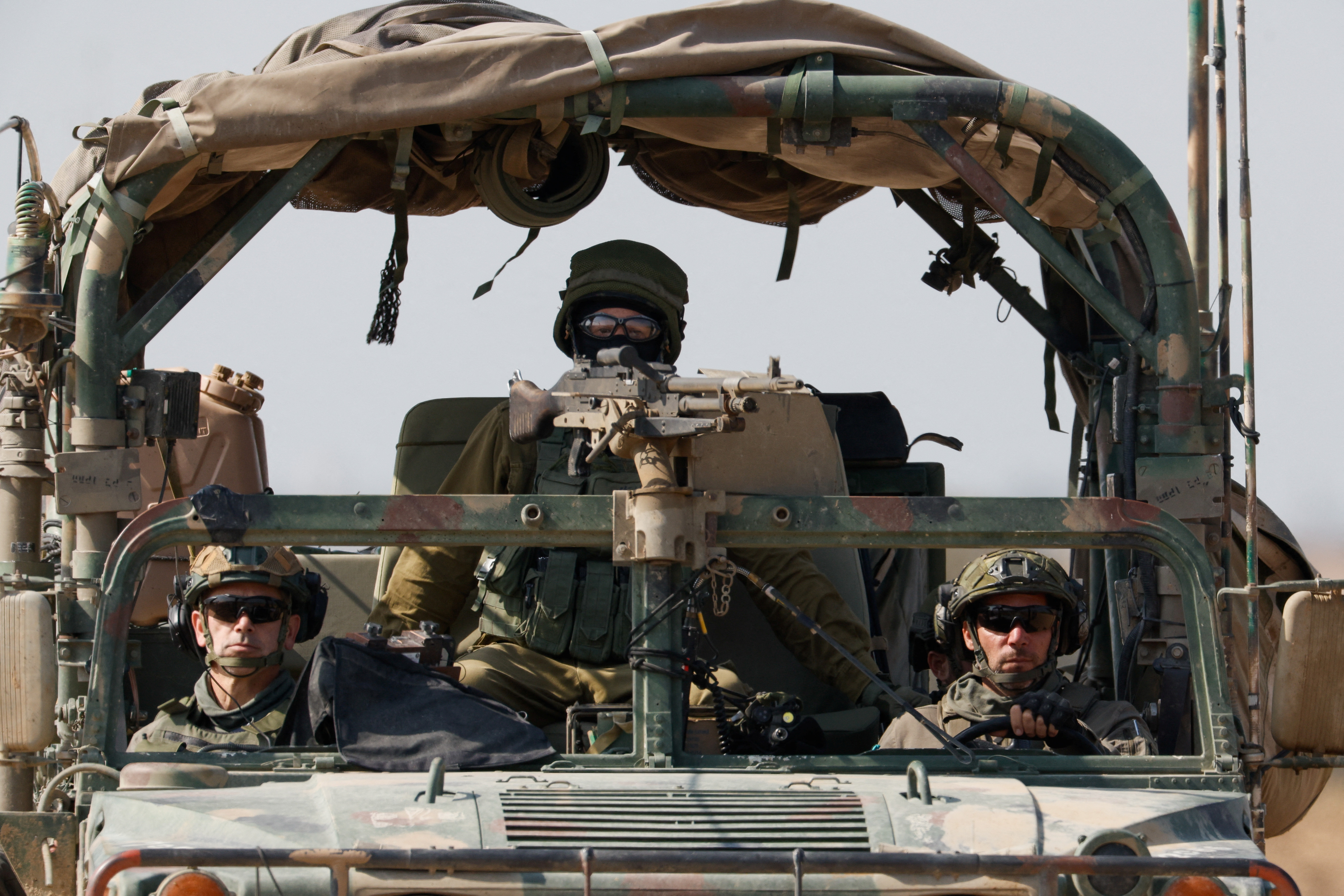A military vehicle maneuvres near the Israel-Gaza border