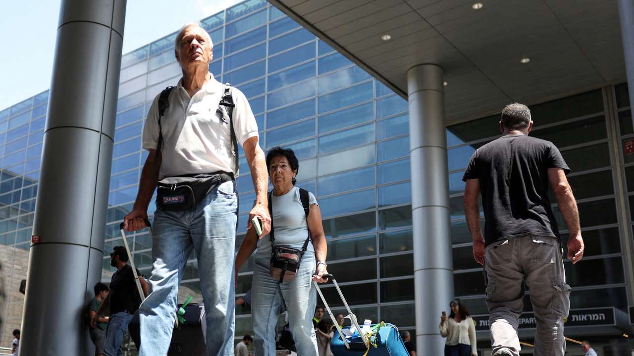 Israeli nationals arrive at Ben Gurion International airport from abroad, in Tel Aviv