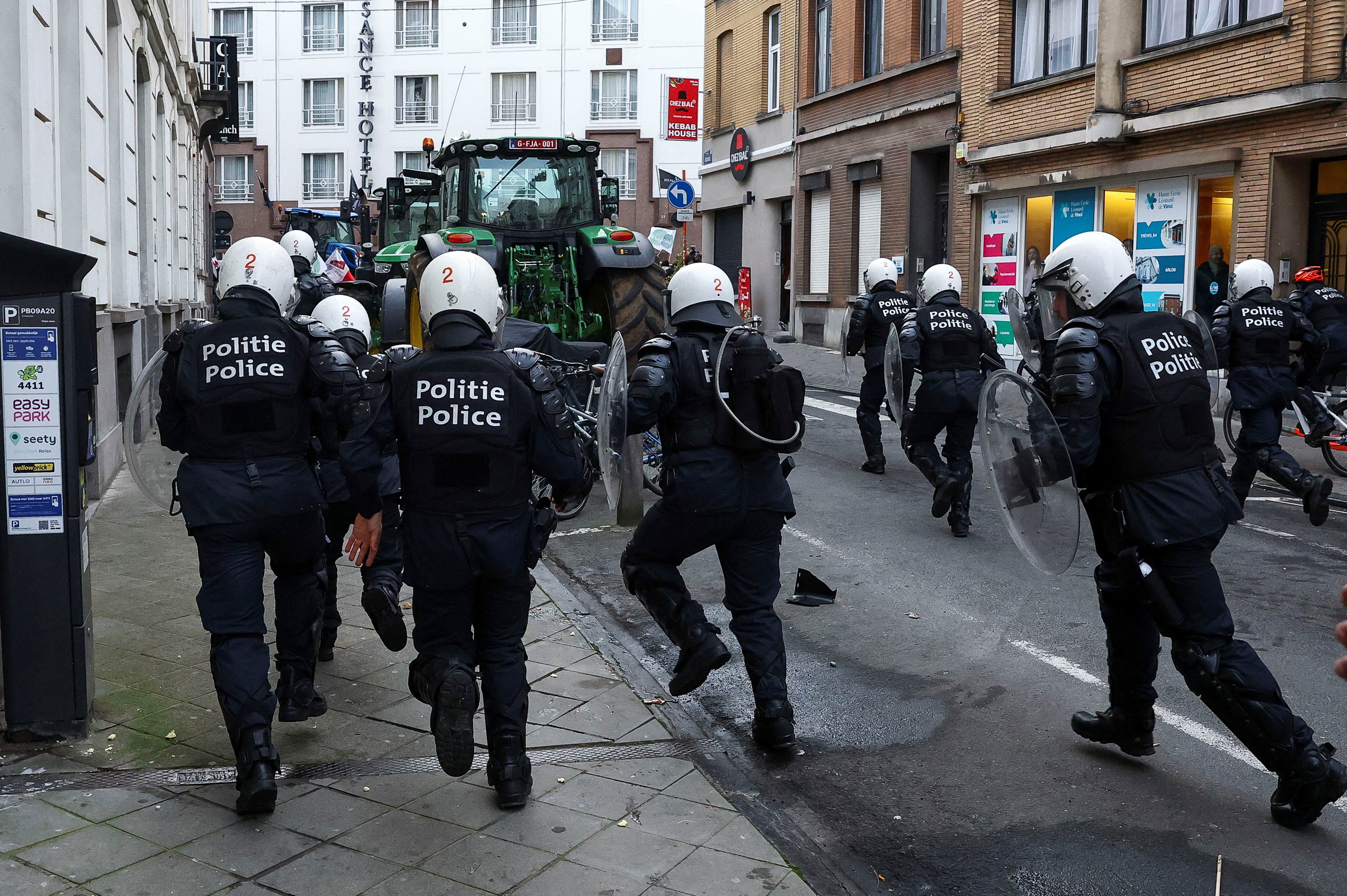 Farmers rally in a large-scale protest in Brussels as leaders meet in EU summit