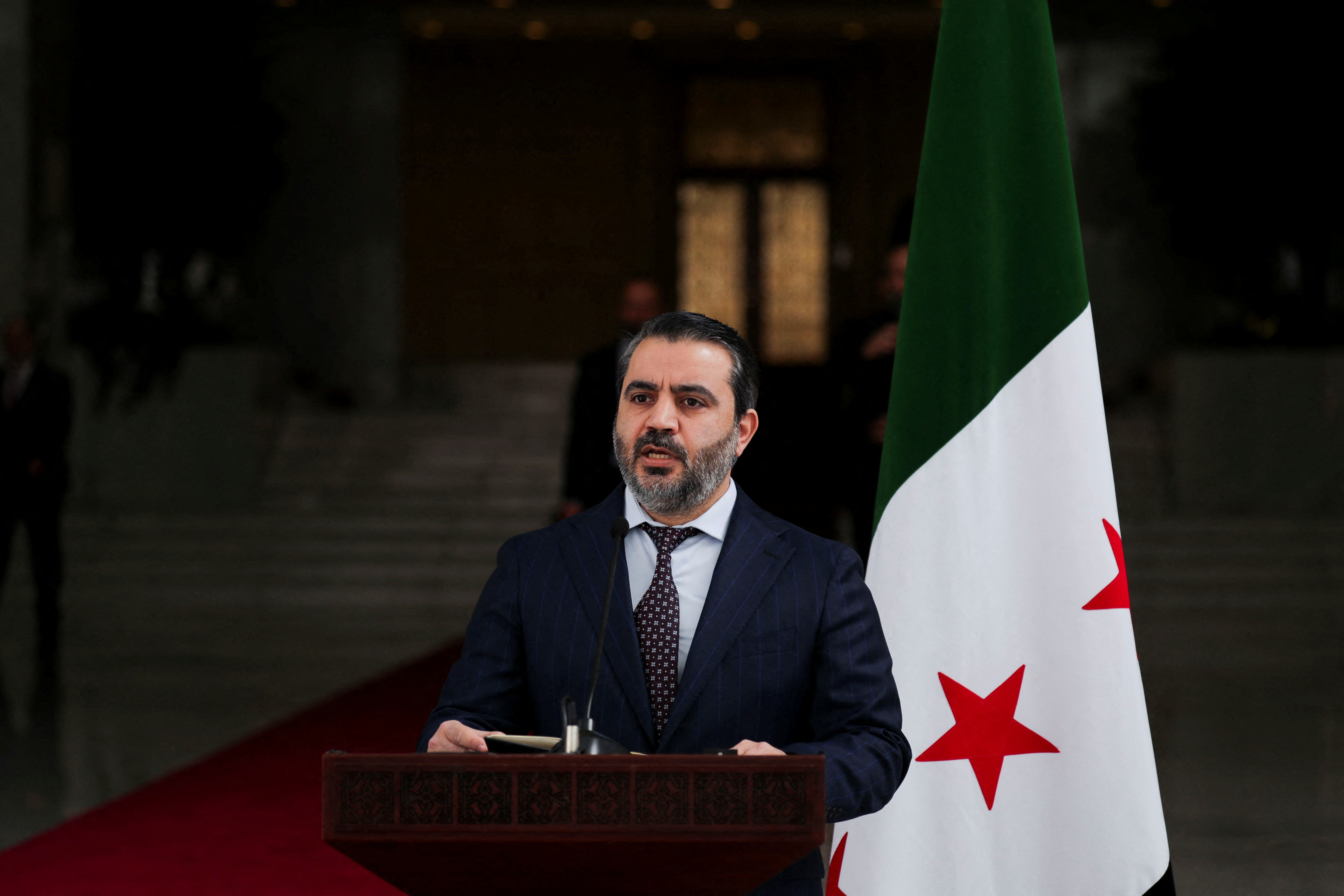Ukrainian Foreign Minister Andrii Sybiha attends a press conference with Syria's foreign minister, Asaad Hassan al-Shibani, after the ousting of Syria's Bashar al-Assad, in Damascus