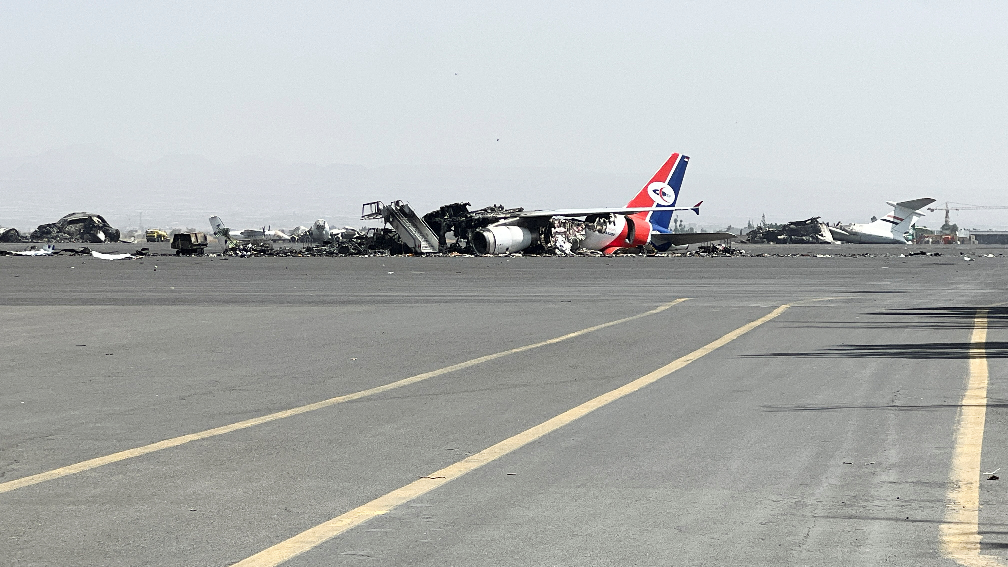 Debris of a destroyed plane lies at Sanaa International Airport, in the aftermath of an Israeli airstrike, in Sanaa, Yemen