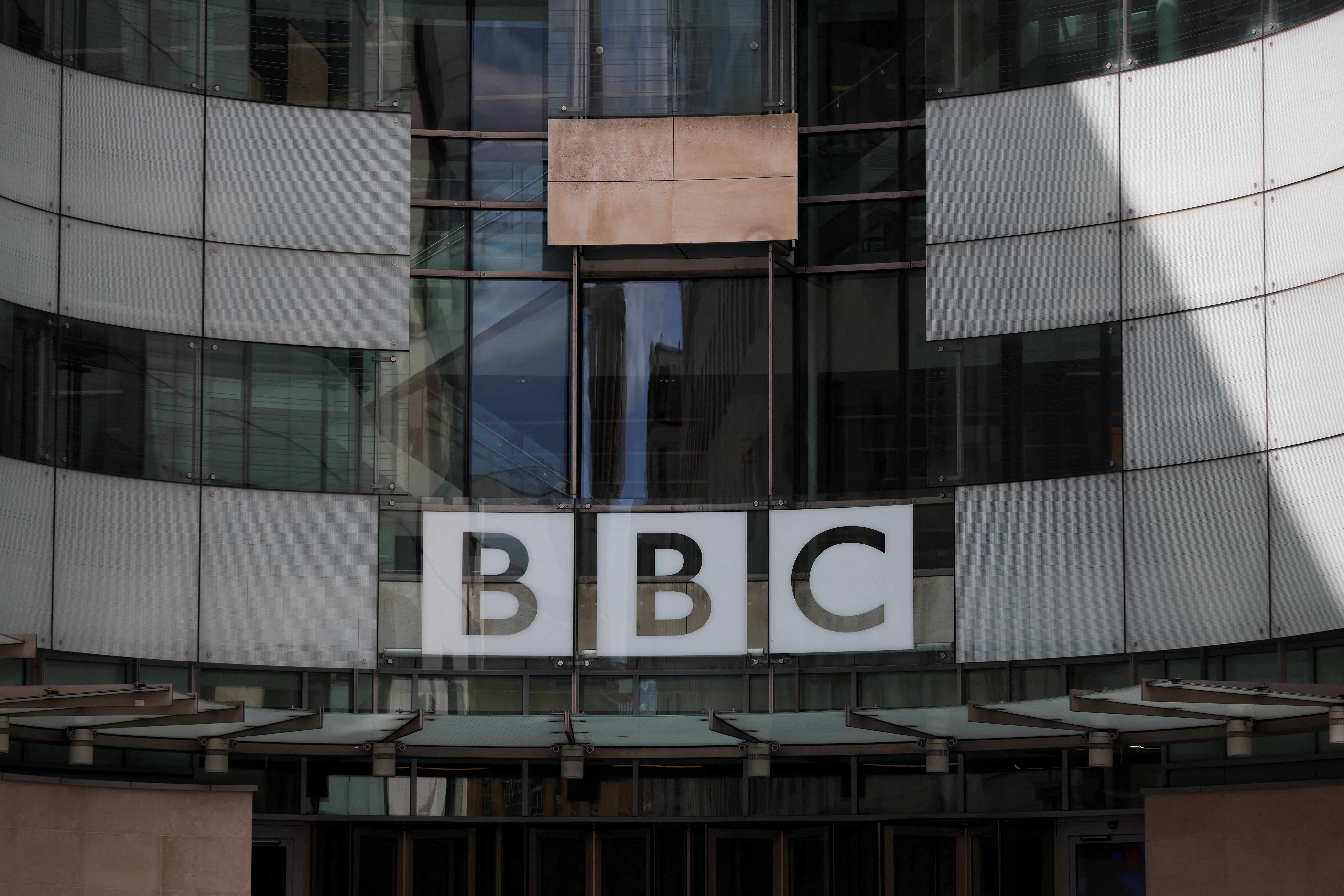 The BBC logo is displayed above the entrance to the BBC headquarters in London