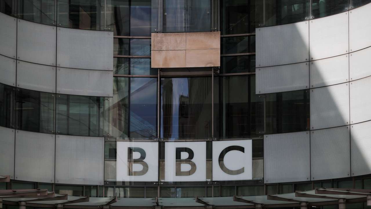 The BBC logo is displayed above the entrance to the BBC headquarters in London
