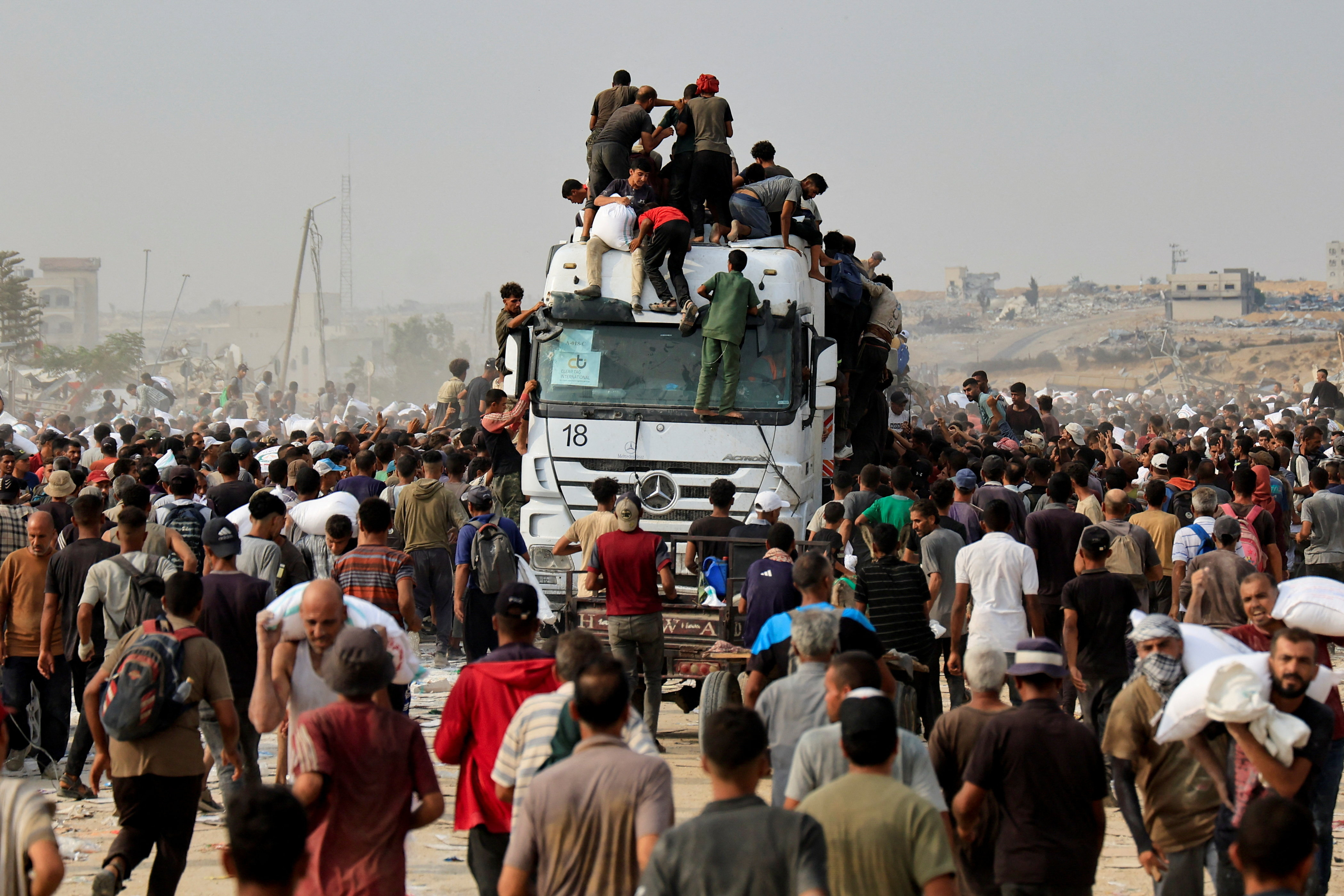 Palestinians seek aid supplies in Khan Younis, southern Gaza Strip