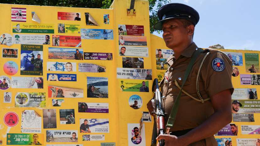 A policeman stands guard in front of the Chabad house in Arugam Bay