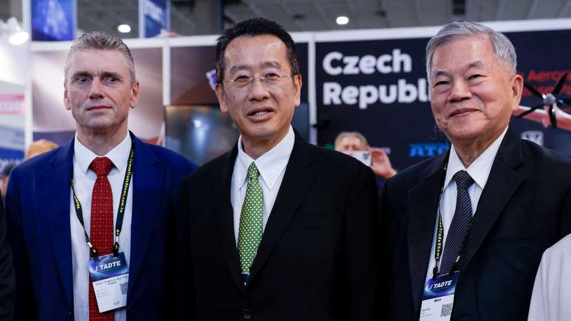 Taiwan’s Defence Minister Wellington Koo poses for photographs with delegates during the Taipei Aerospace and Defence Technology Exhibition at the Czech Republic pavilion