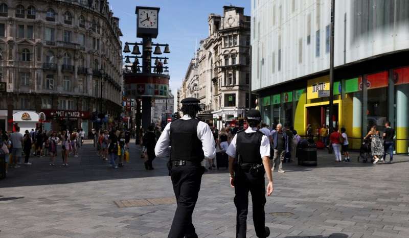 Police are seen in Leicester Square after knife attack