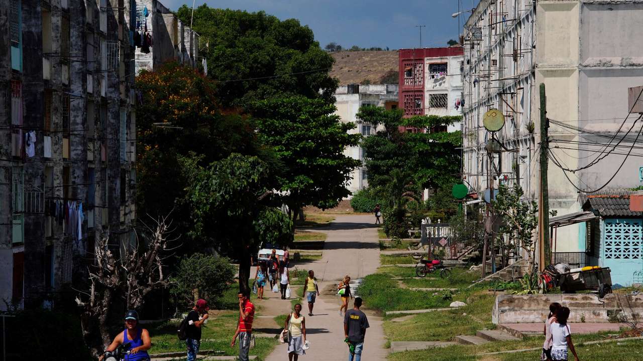 FILE PHOTO: People walk on a street, in Santiago