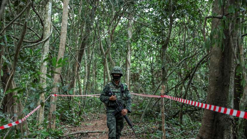 FILE PHOTO: Thai military personnel stand guard near Thai-Cambodian border at Chong Chub Ta Mok area in Surin Province