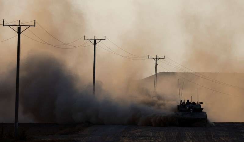A tank manoeuvres near the Israel-Gaza border