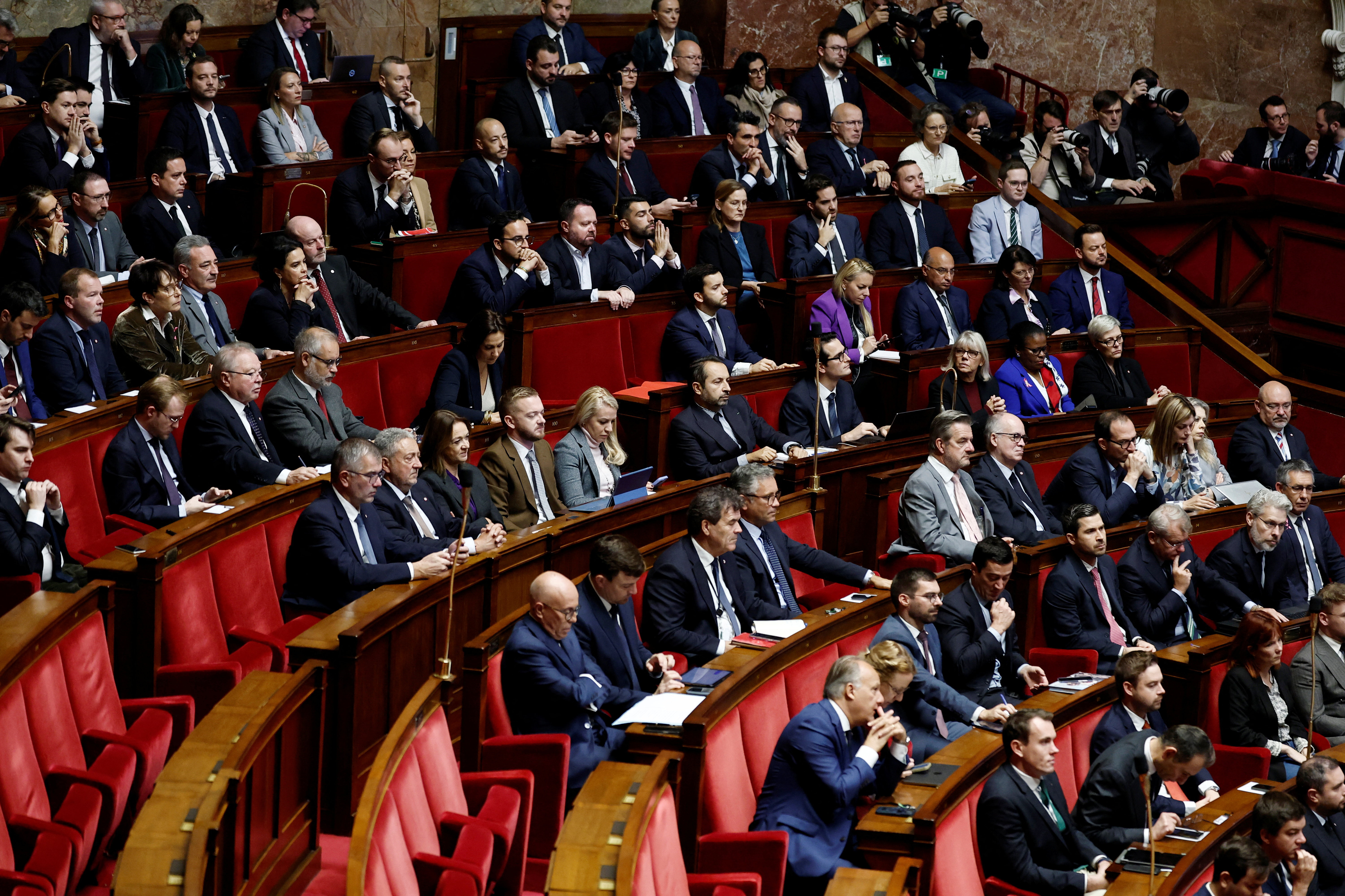 French parliament debates and votes two no-confidence motions against the new government