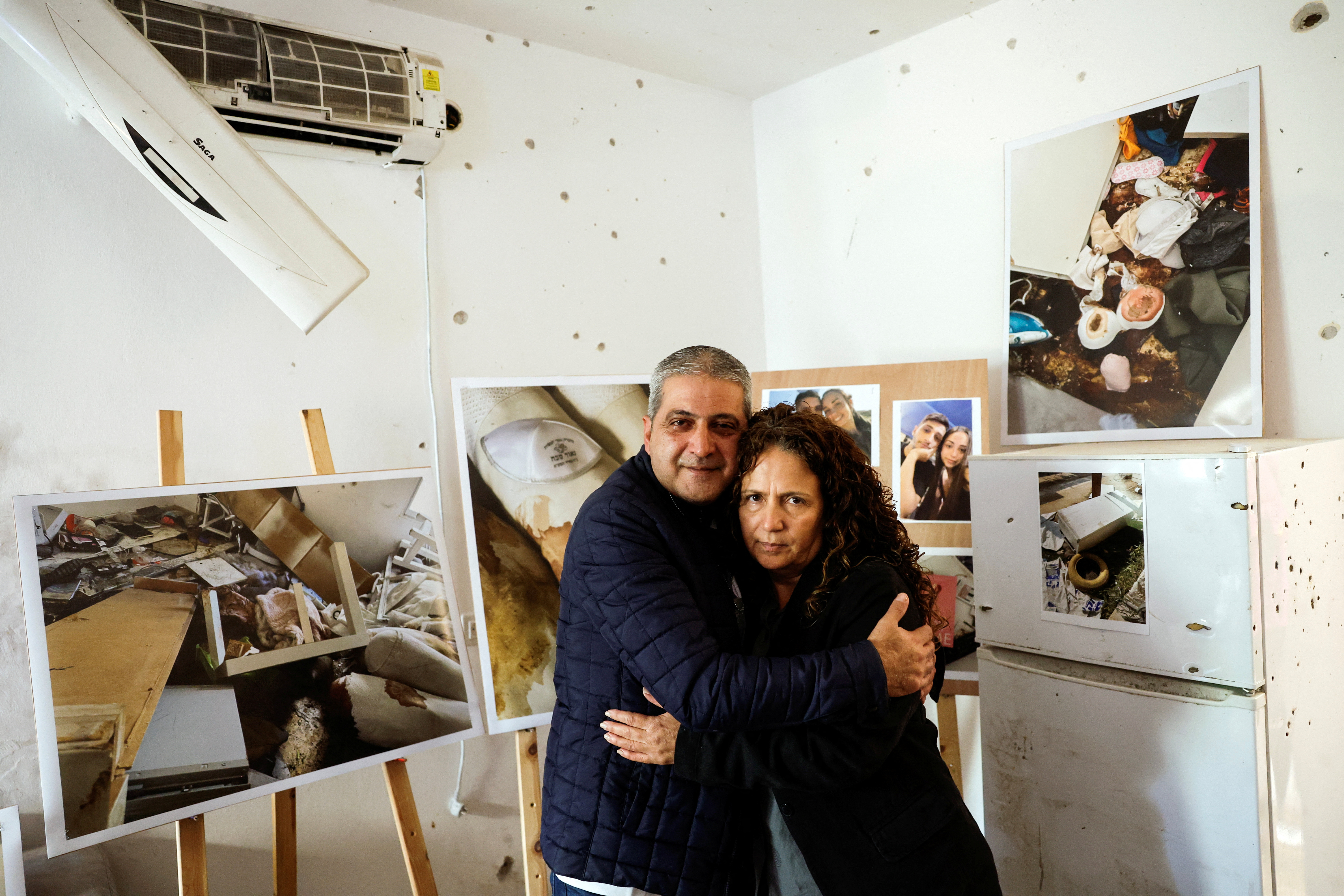 Parents of Israeli couple killed during the deadly October 7 attack by Hamas visit Kibbutz Kfar Aza