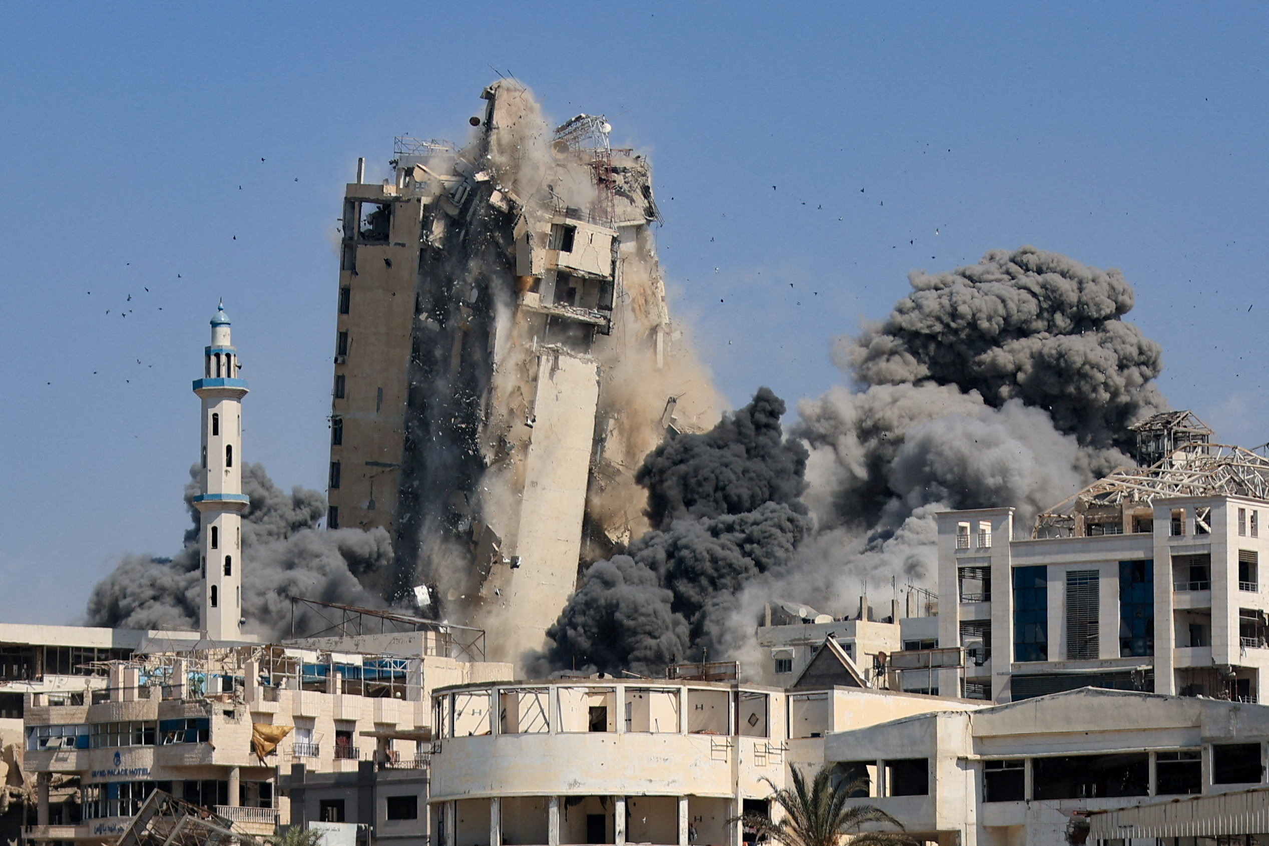 Israeli air strikes hit the evacuated Al-Ghefari residential tower in Gaza City