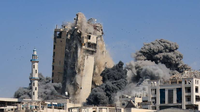 Israeli air strikes hit the evacuated Al-Ghefari residential tower in Gaza City