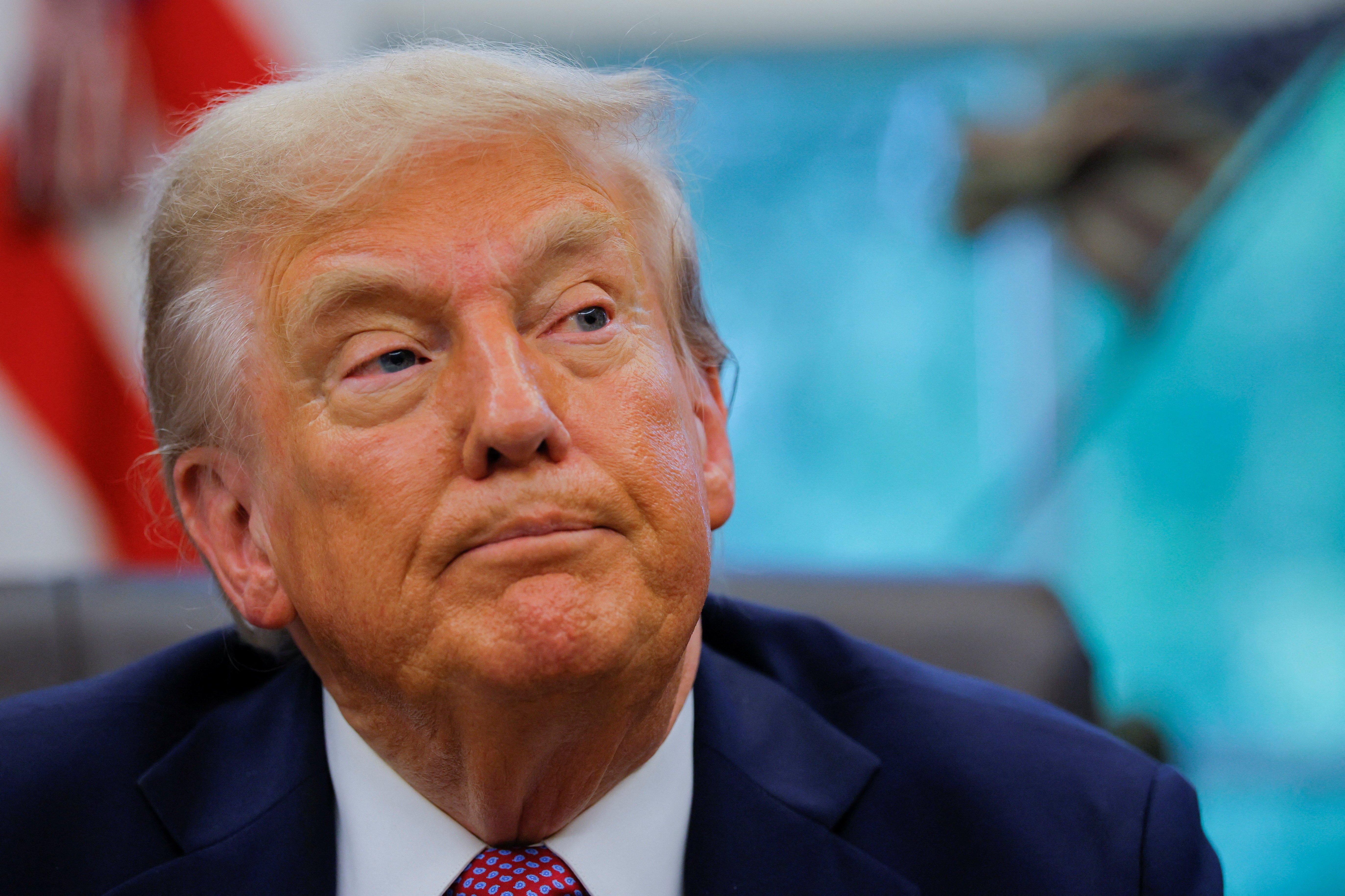 U.S. President Donald Trump signs an executive order at the White House in Washington, D.C.