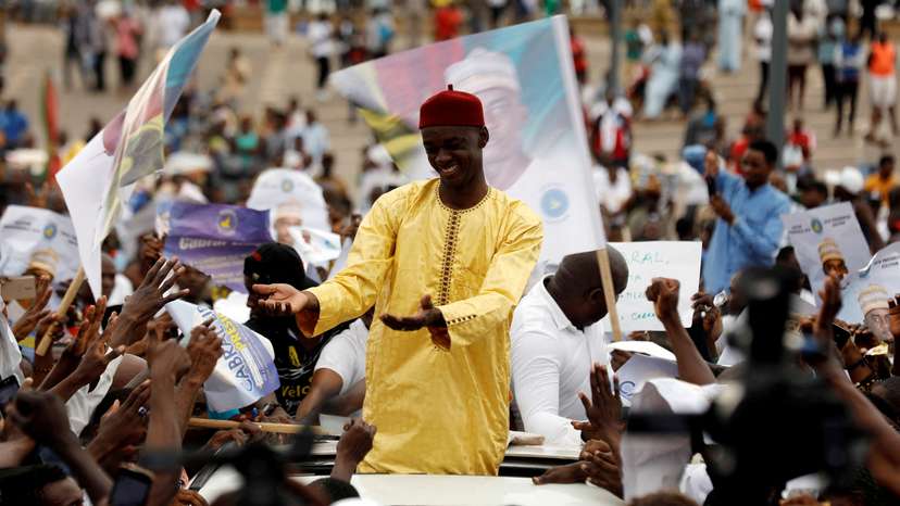 FILE PHOTO: Presidential candidate Cabral Libii of Univers party greets supporters as he arrives for his final campaign rally in Yaounde