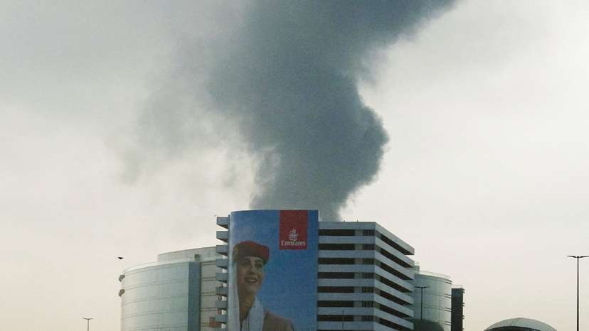 Smoke rises from the Dubai International Airport