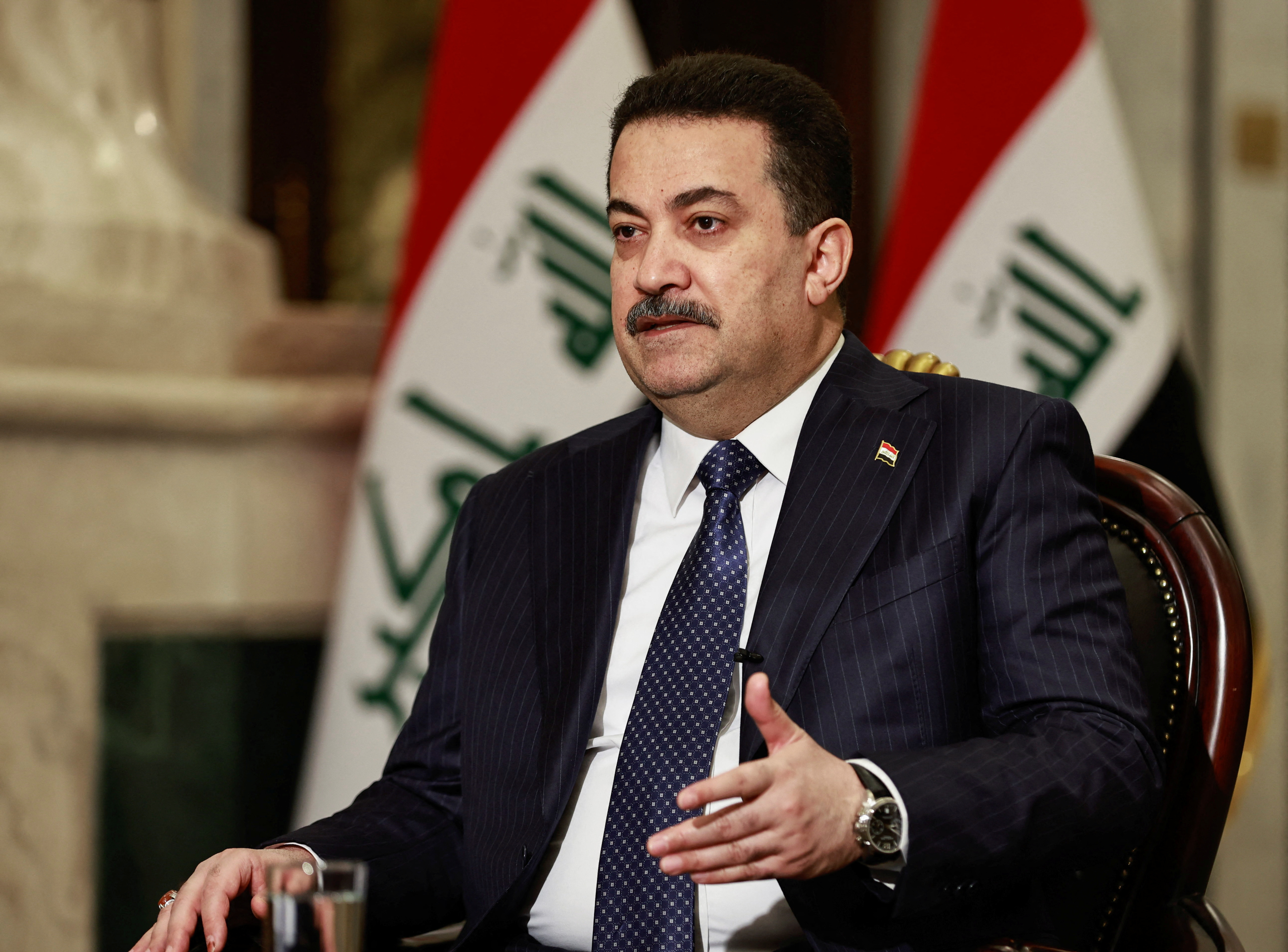 Iraqi Prime Minister Mohammed Shia al-Sudani speaks during an interview with Reuters in Baghdad