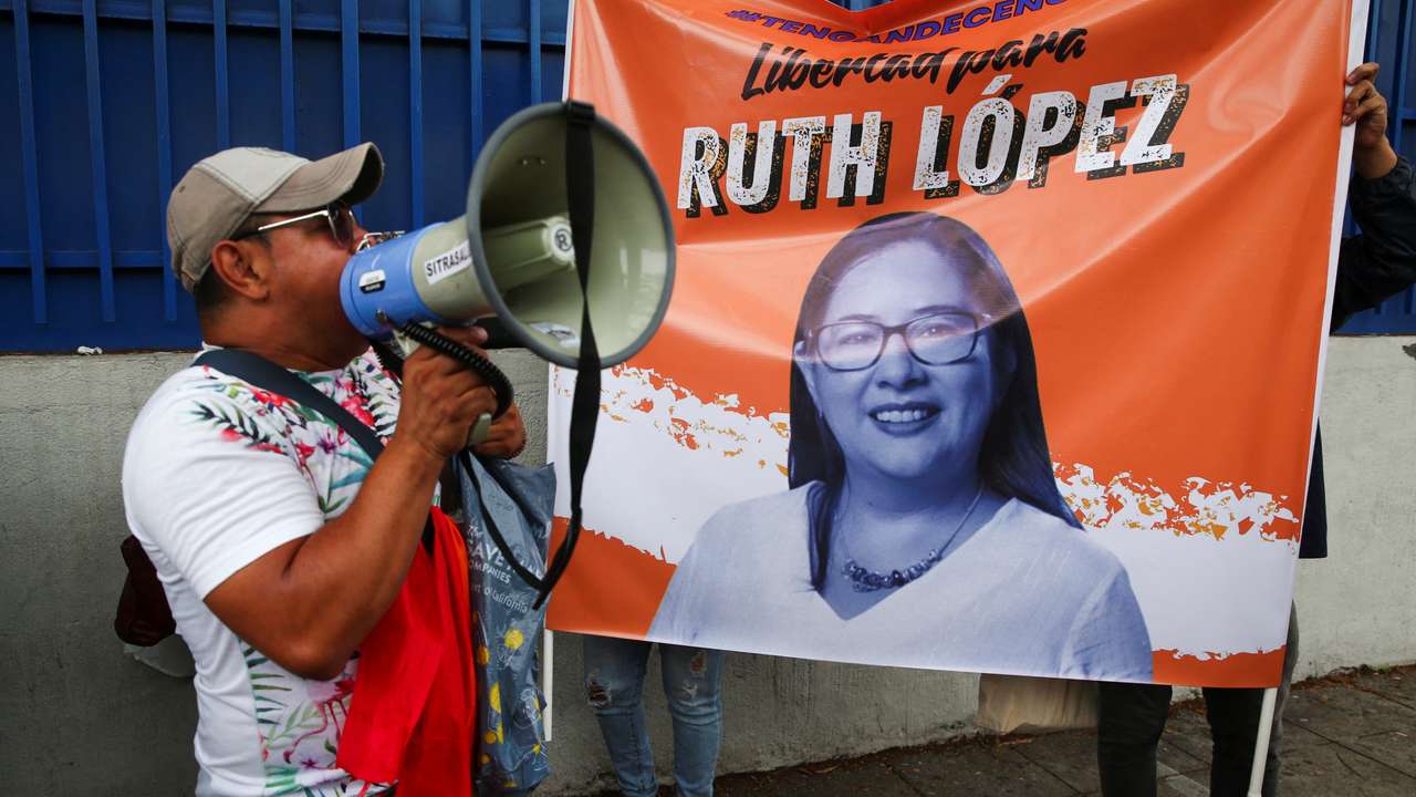 Supporters of Ruth Lopez, anti-corruption and justice director of Cristosal, protest in San Salvador