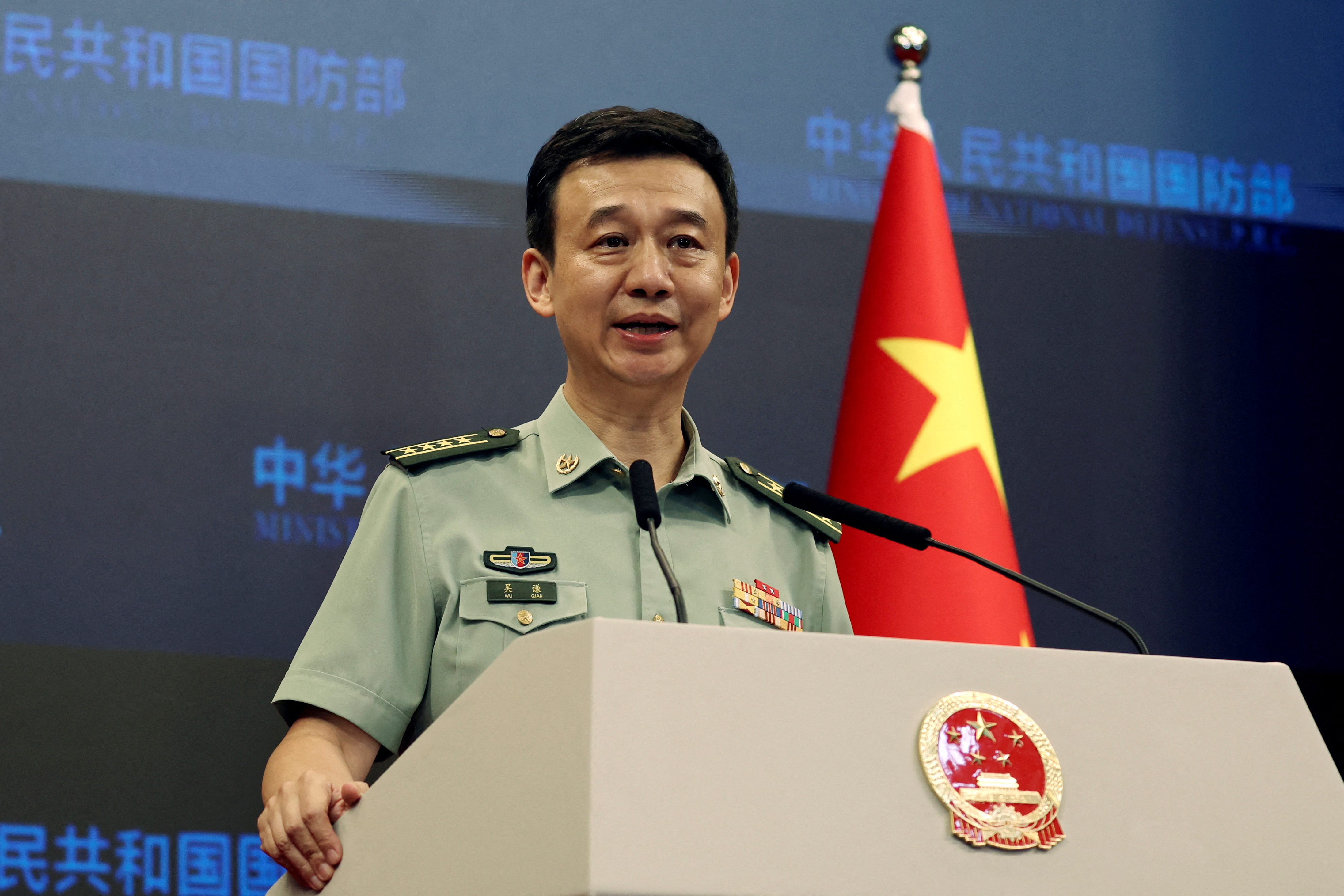 FILE PHOTO: Chinese Defence Ministry spokesperson Wu Qian attends a press briefing in Beijing