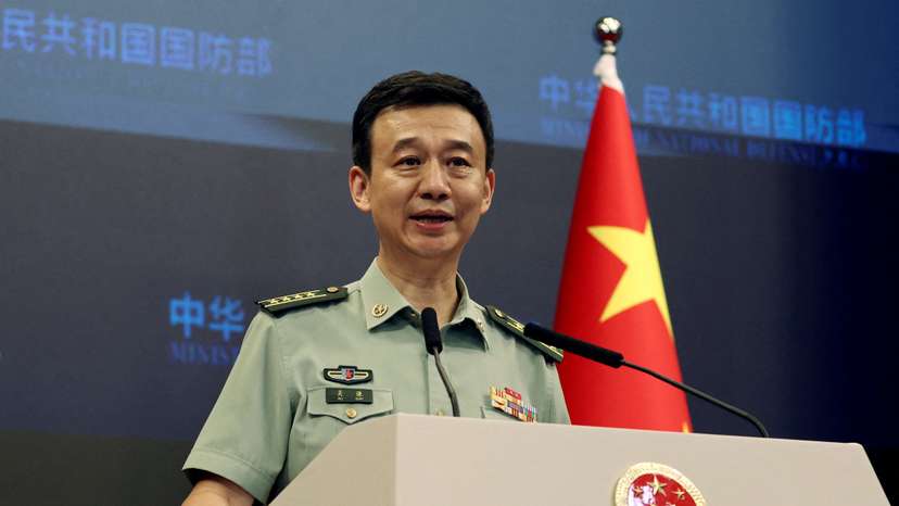 FILE PHOTO: Chinese Defence Ministry spokesperson Wu Qian attends a press briefing in Beijing