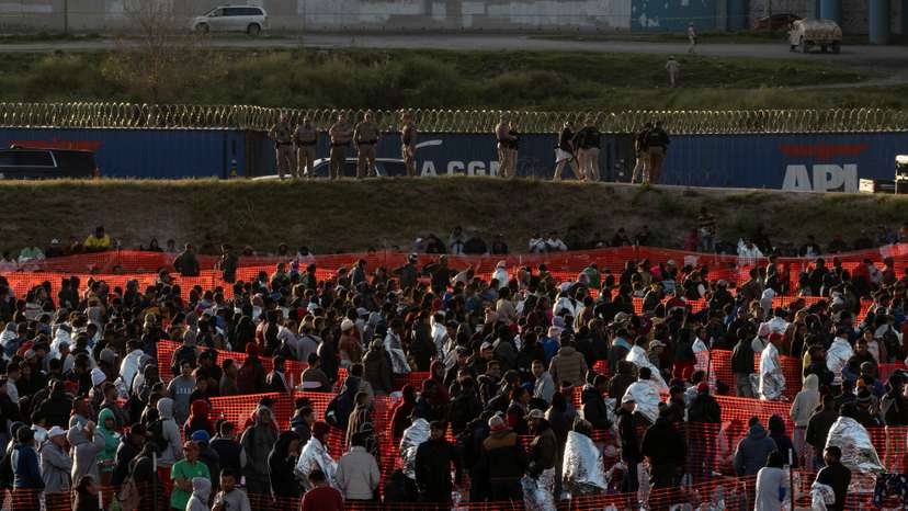 Migrants cross from Mexico into Eagle Pass, Texas