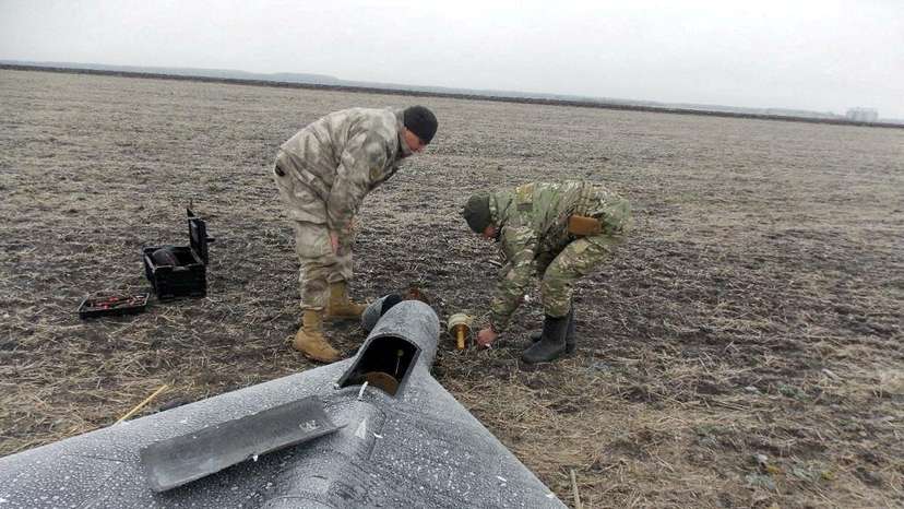 FILE PHOTO: Members of police demining unit remove a warhead from a Russian kamikaze unmanned aerial vehicle landed by a radio electronic warfare during one of latest drone strikes in an unknown location in Ukraine