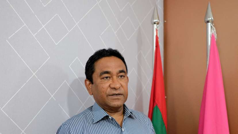 Abdulla Yameen poses for a photo at his party office in Male