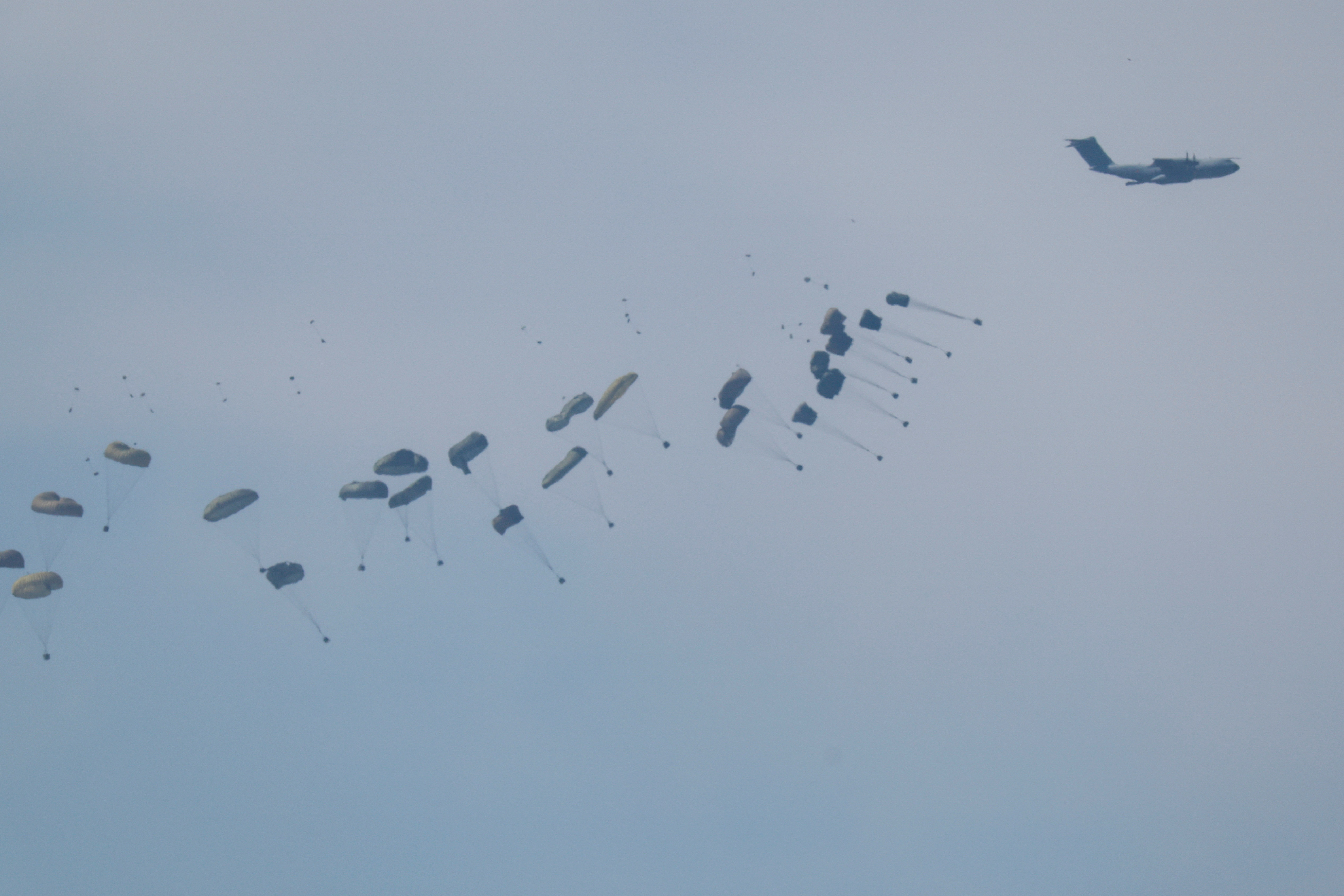An airplane drops aid over Gaza