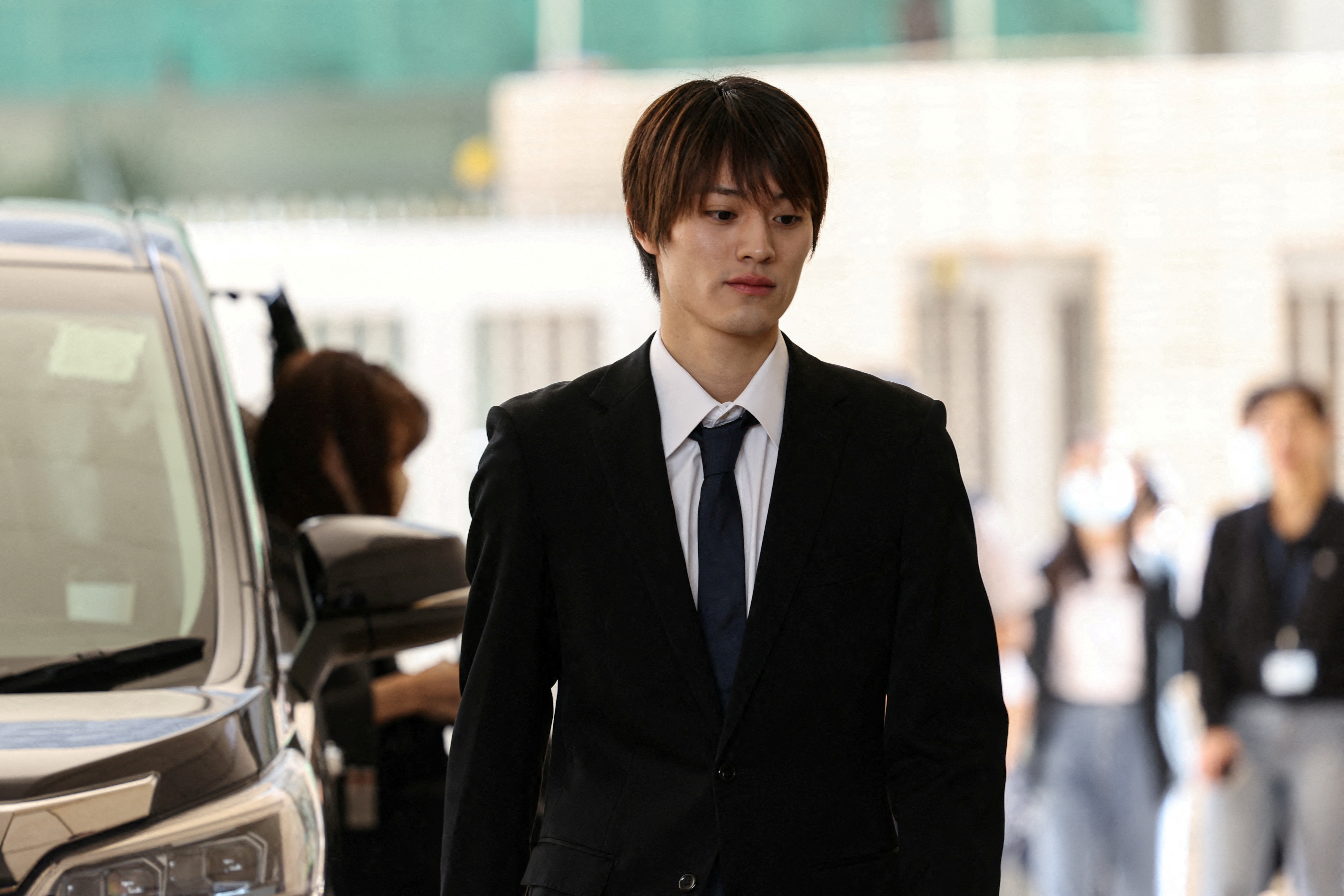 Kenshin Kamimura, a former member of the Japanese boy band ONE N' ONLY, arrives at West Kowloon Magistrates' Courts over his charge of indecent assault in Hong Kong