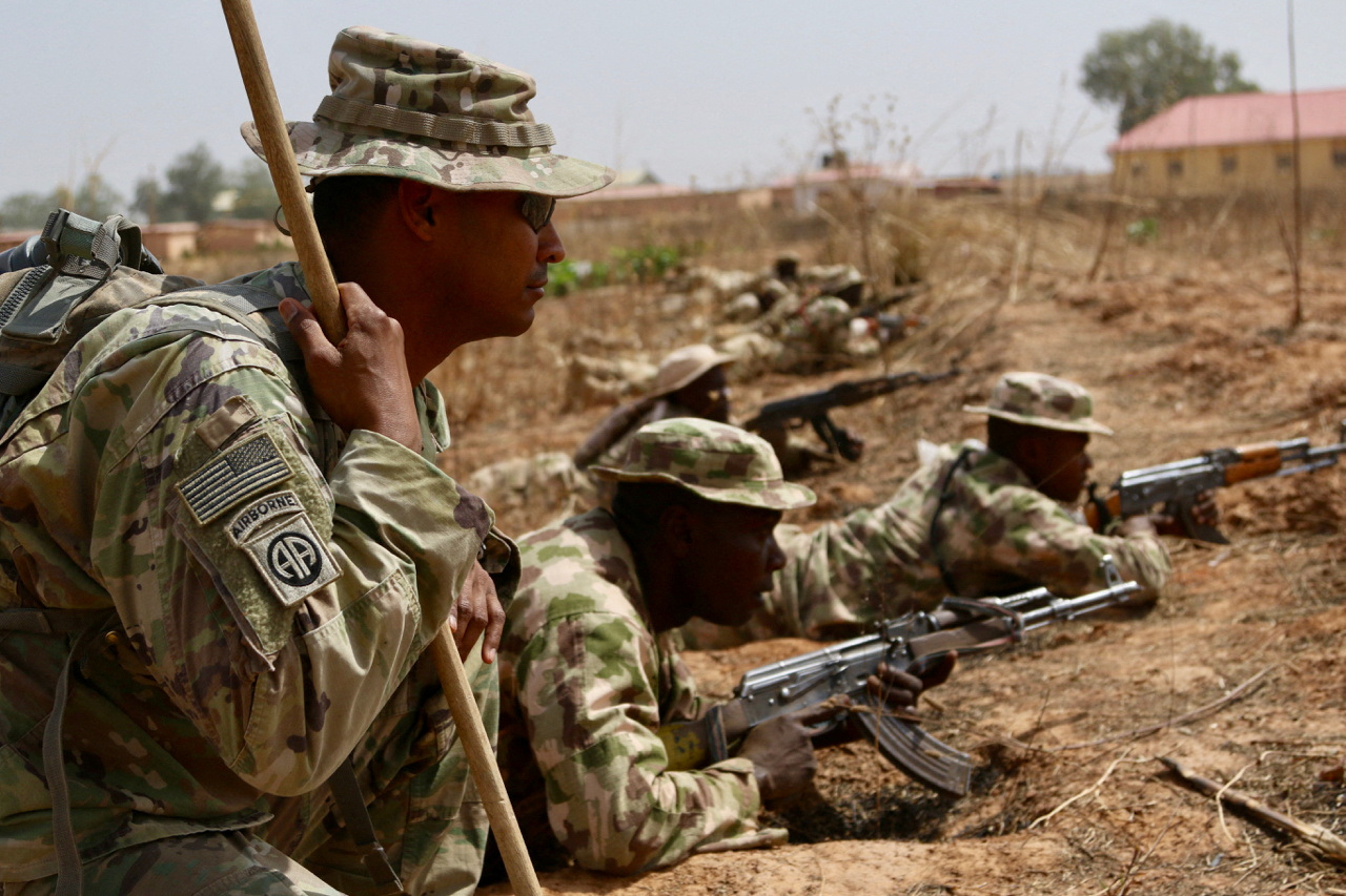A U.S. Army soldier trains Nigerian Army soldiers at a military compound in Jaji, Nigeria