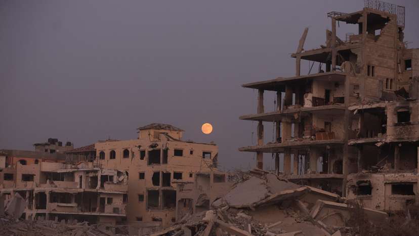 The Beaver Moon supermoon rises above destroyed buildings amid a ceasefire between Israel and Hamas, in Gaza City