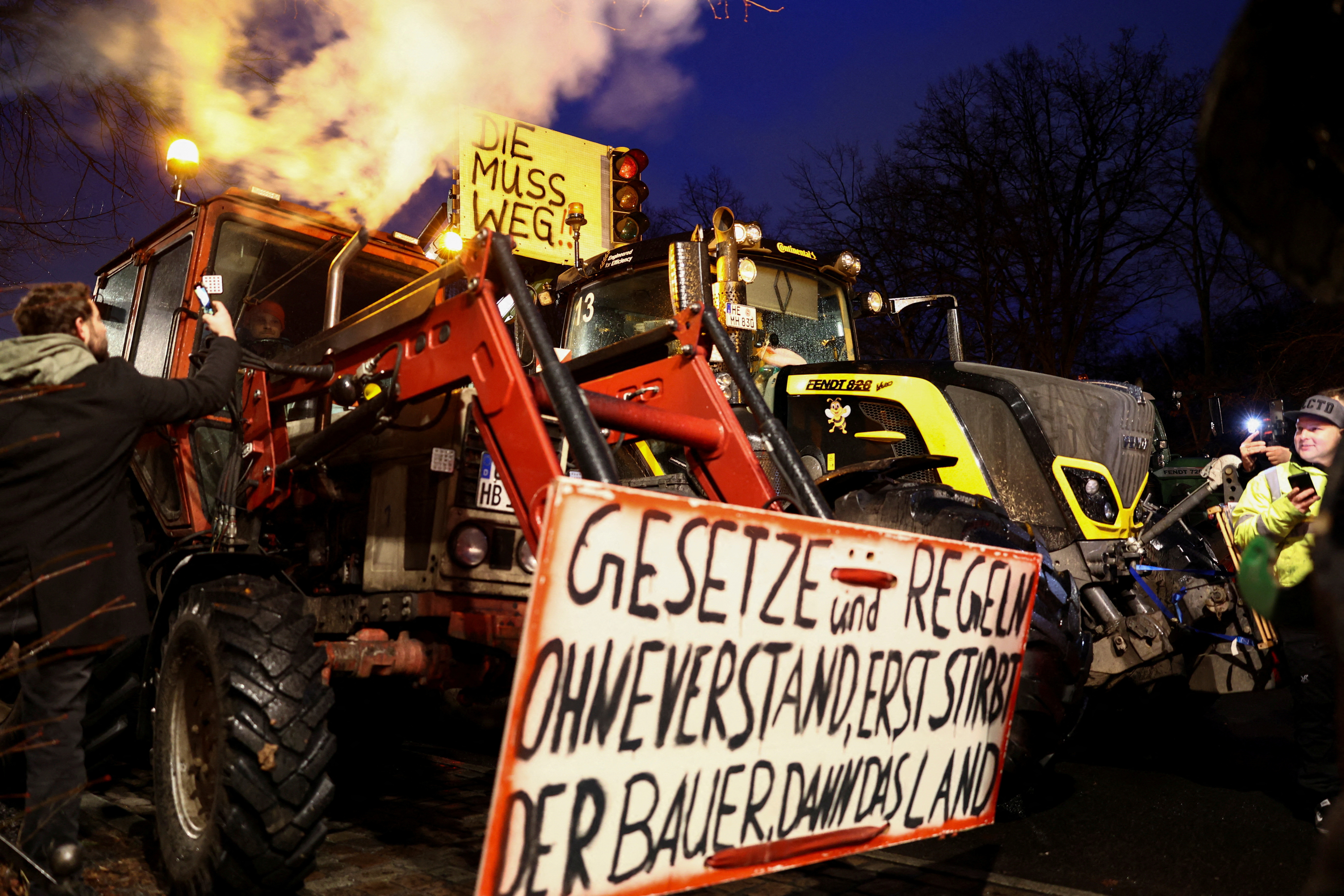 German farmers prepare for a protest against the cut of farm vehicle tax subsidies in Berlin