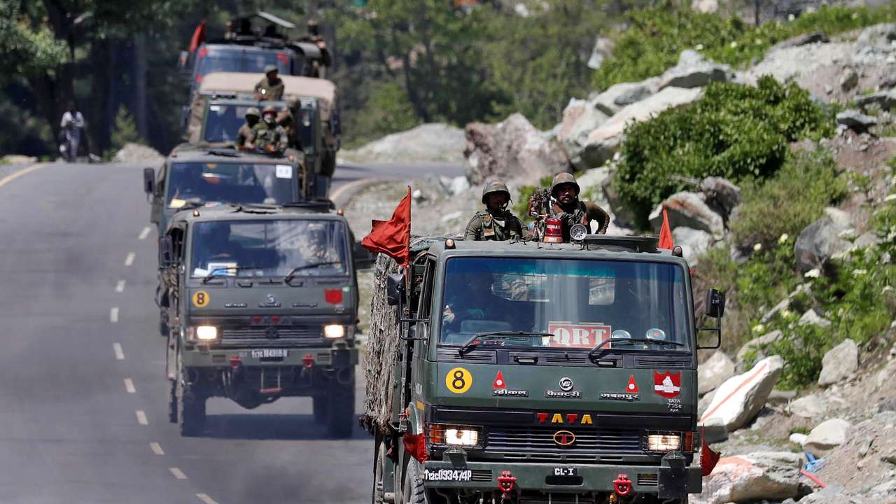 Indian Army convoy moves along a highway leading to Ladakh, at Gagangeer
