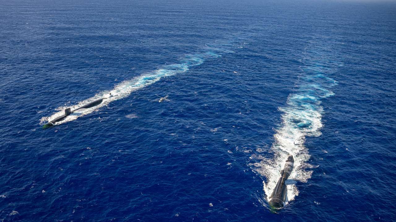 USS Asheville (SSN 758) and USS Annapolis (SSN 760) conduct photo exercise off the coast of Guam