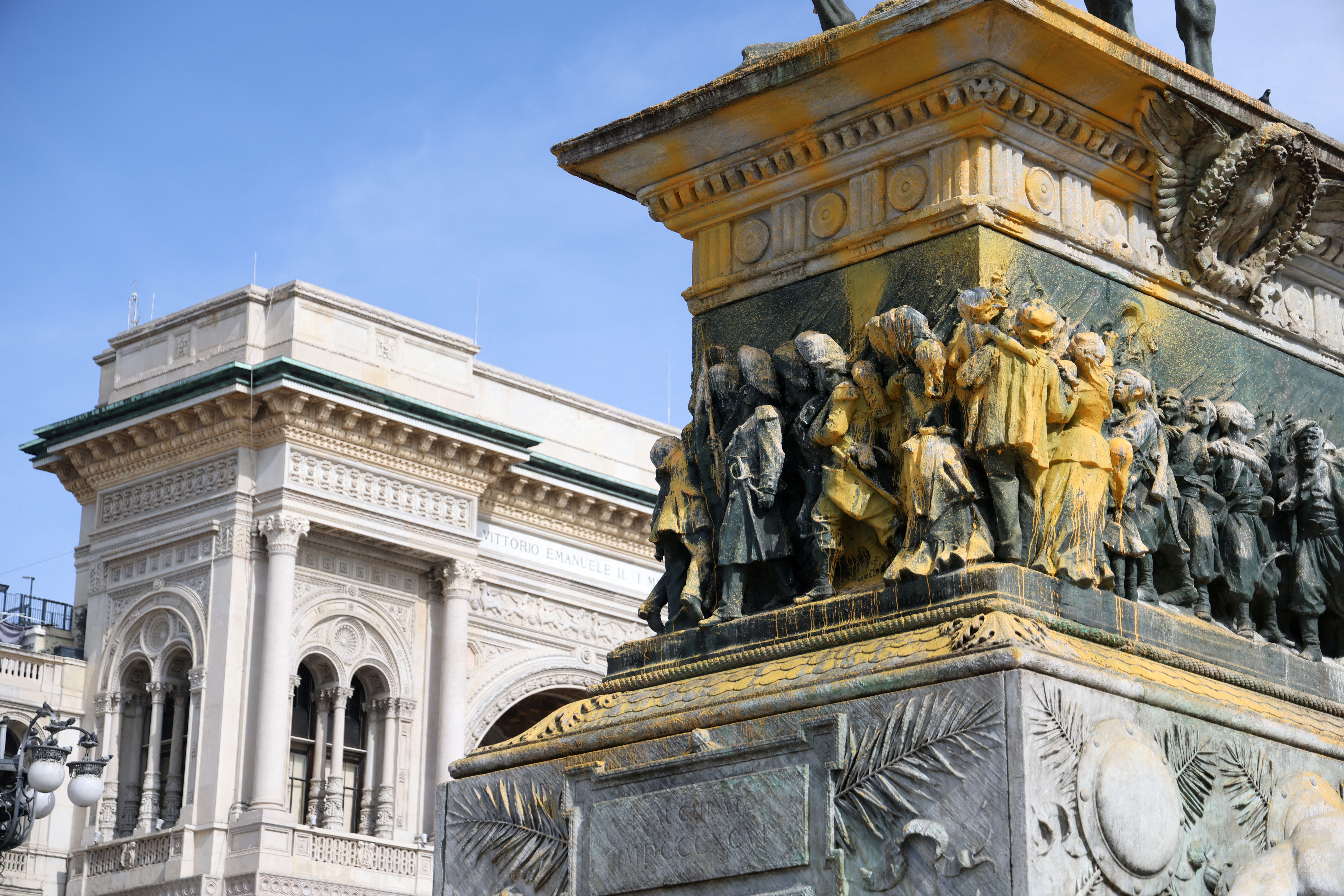 FILE PHOTO: Statue of Italy's King Vittorio Emanuele II in Piazza Duomo doused with paint by Last Generation climate activists in Milan