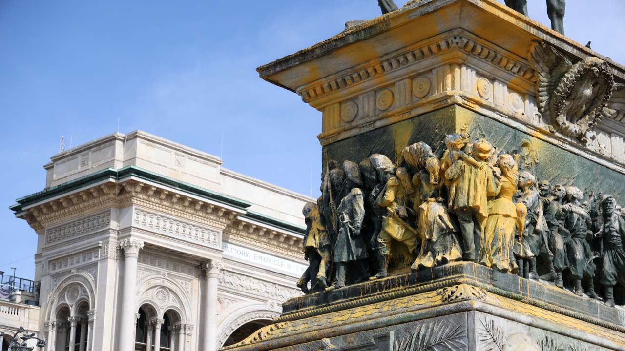 FILE PHOTO: Statue of Italy's King Vittorio Emanuele II in Piazza Duomo doused with paint by Last Generation climate activists in Milan