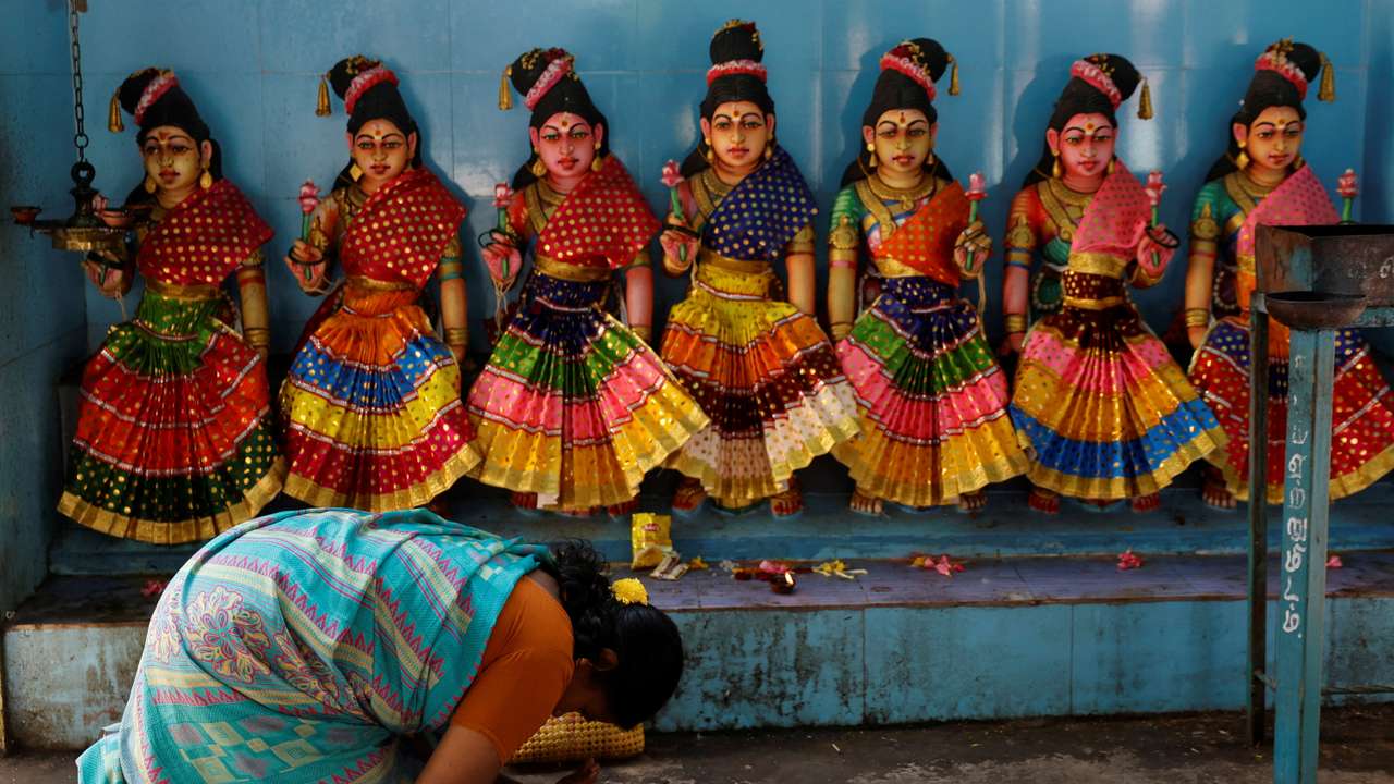 A devotee prays inside the Sri Dharmasastha temple in Thulasendrapuram