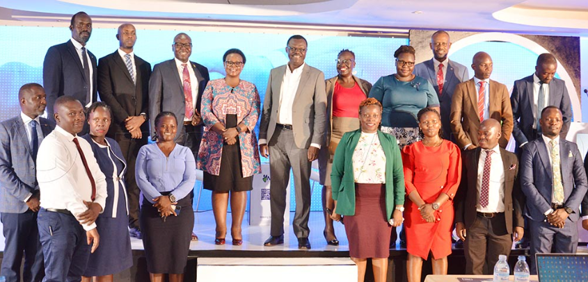 Patrick Ayota managing director NSSF (center) with regional NSSF staff of Gulu, Lira and Arua 