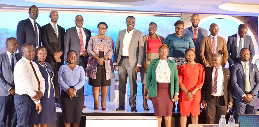Patrick Ayota managing director NSSF (center) with regional NSSF staff of Gulu, Lira and Arua