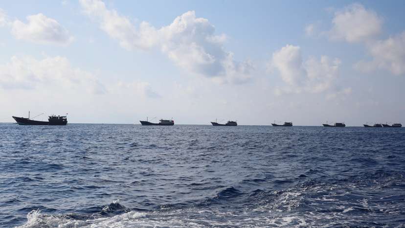 Chinese boats fish at the disputed Scarborough Shoal