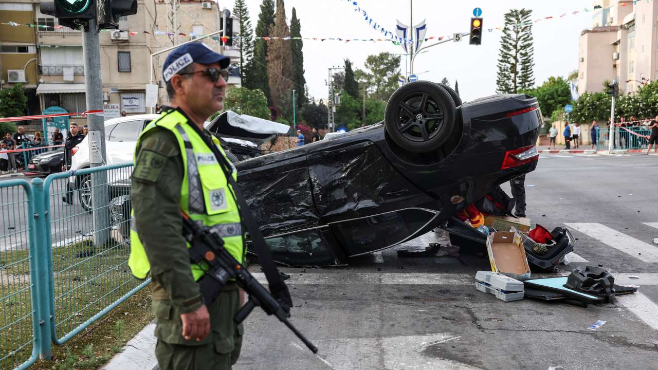 Israeli security forces secure the area where a suspected stabbing incident took place, in Ramle