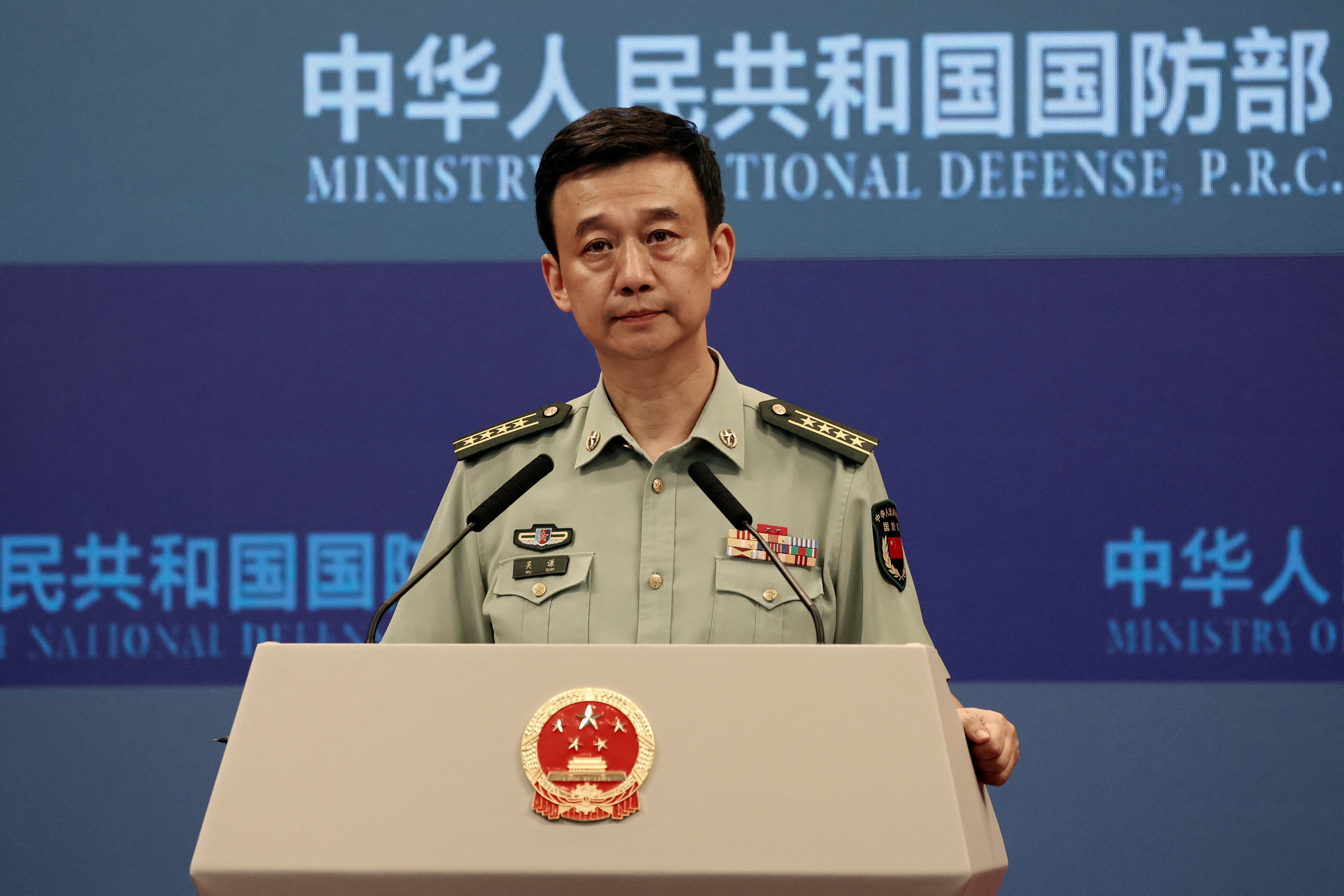 Chinese Defence Ministry spokesperson Wu Qian attends a press briefing in Beijing