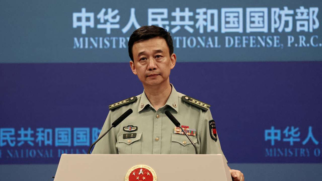 Chinese Defence Ministry spokesperson Wu Qian attends a press briefing in Beijing